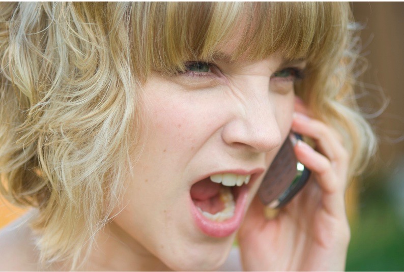 Angry woman yelling on phone
